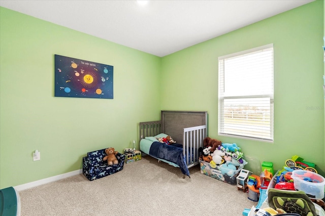 carpeted bedroom featuring baseboards