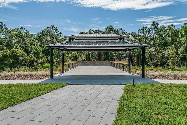 view of home's community with a gazebo, a carport, and driveway