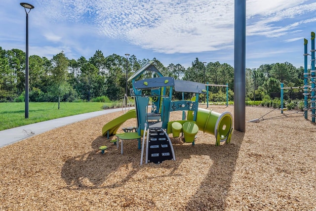 community jungle gym featuring a yard