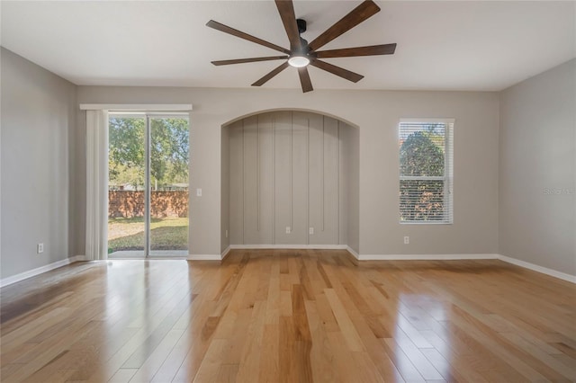 unfurnished room featuring ceiling fan and light hardwood / wood-style floors