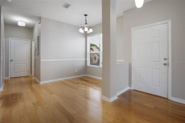 entryway featuring a notable chandelier and light hardwood / wood-style flooring