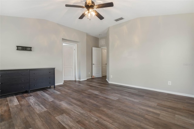 interior space featuring ceiling fan, dark hardwood / wood-style floors, and vaulted ceiling