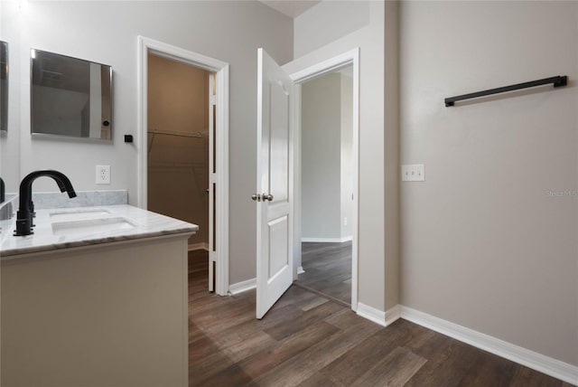 hallway featuring sink and dark hardwood / wood-style floors