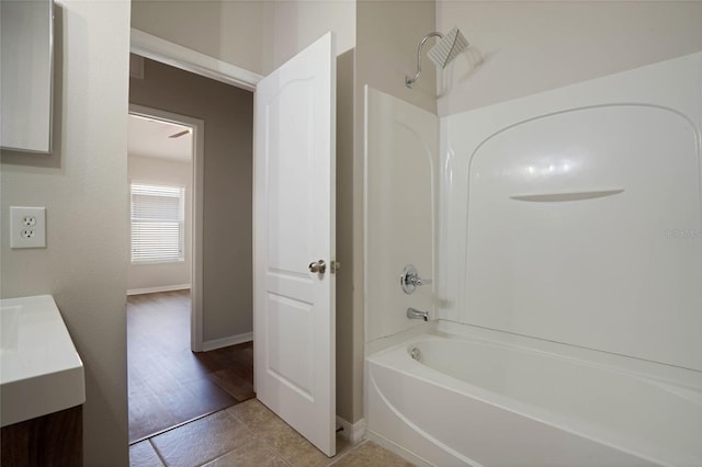 bathroom featuring vanity, tile patterned flooring, and shower / bathing tub combination