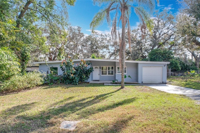 single story home featuring a garage and a front lawn