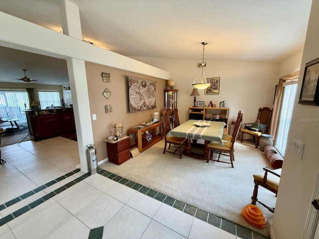 dining room featuring a textured ceiling and light tile patterned floors