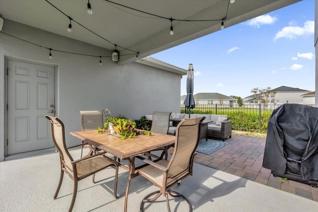 view of patio with area for grilling and an outdoor living space