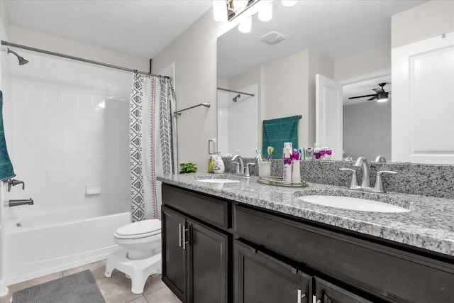 full bathroom featuring shower / tub combo with curtain, toilet, vanity, ceiling fan, and tile patterned flooring