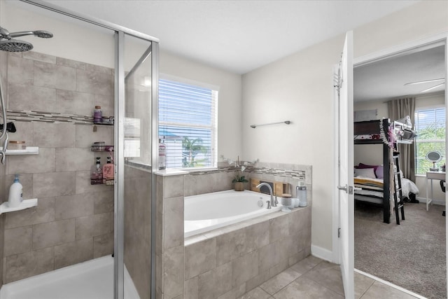 bathroom featuring tile patterned floors and independent shower and bath