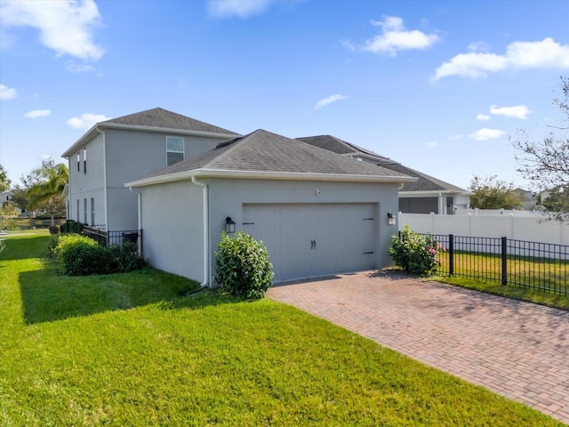 view of property exterior with a yard and a garage