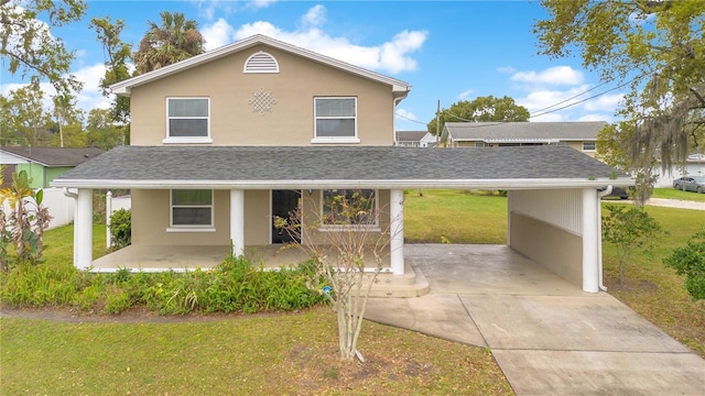 traditional-style home with covered porch, stucco siding, a shingled roof, and a front yard