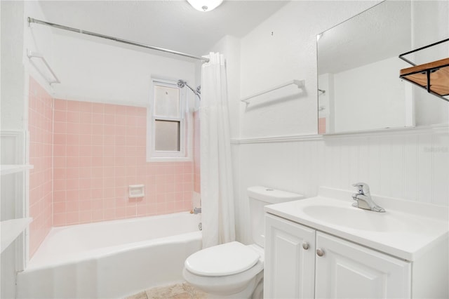 full bathroom with shower / bathtub combination with curtain, toilet, and vanity