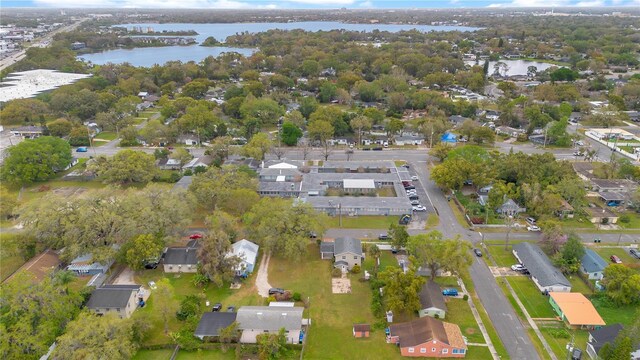 birds eye view of property with a residential view and a water view