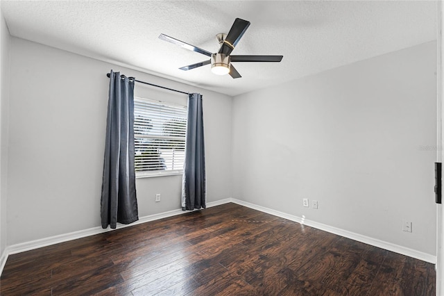 empty room with ceiling fan, a textured ceiling, and dark hardwood / wood-style flooring