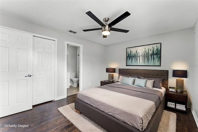 bedroom featuring ceiling fan, a closet, dark hardwood / wood-style flooring, and ensuite bath