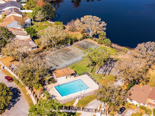 birds eye view of property with a water view