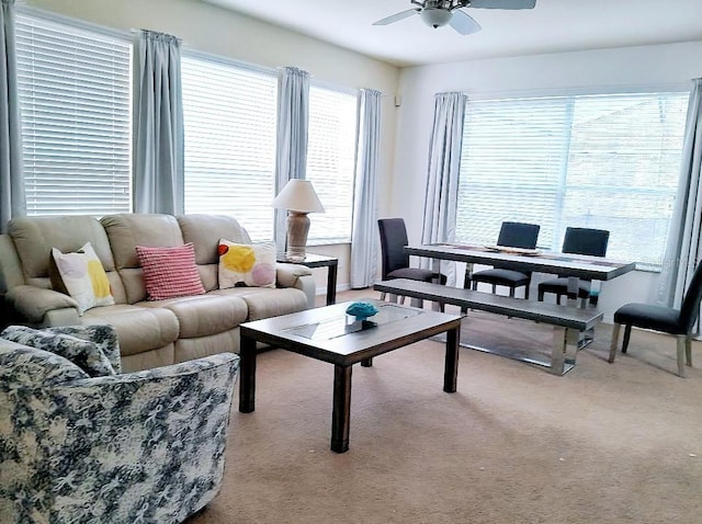 living room with light carpet and ceiling fan