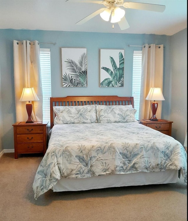 bedroom with ceiling fan and carpet