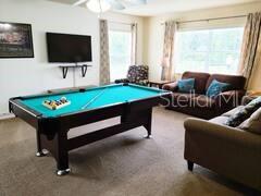 playroom featuring pool table, carpet floors, and ceiling fan