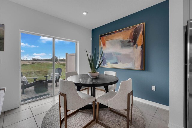 dining room with light tile patterned flooring