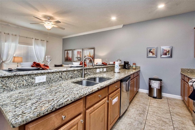 kitchen with dishwasher, sink, light tile patterned floors, light stone countertops, and a textured ceiling