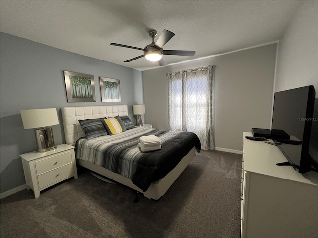 carpeted bedroom with a textured ceiling and ceiling fan