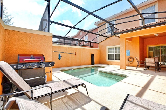 view of swimming pool with a lanai and a patio