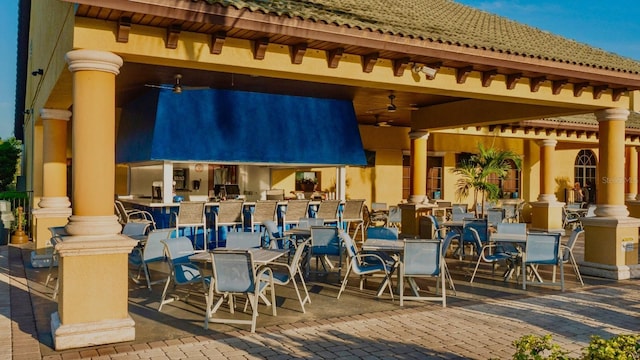 view of patio featuring ceiling fan