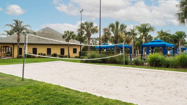 view of community featuring a yard and volleyball court