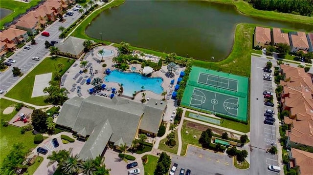 birds eye view of property with a water view