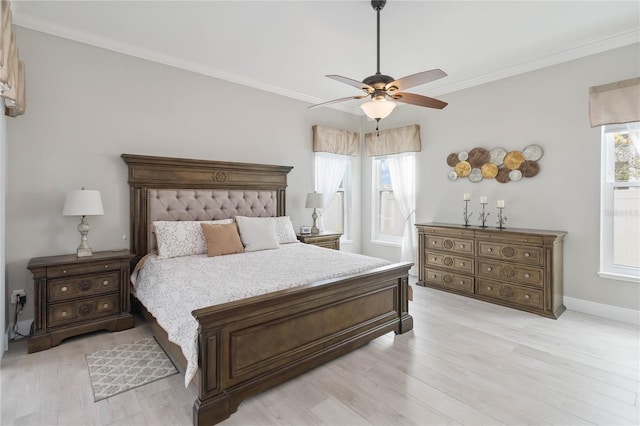 bedroom with ornamental molding, ceiling fan, and light wood-type flooring