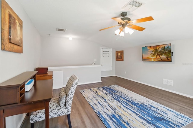 unfurnished office featuring lofted ceiling, dark hardwood / wood-style floors, and ceiling fan