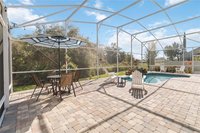 view of patio featuring glass enclosure