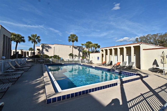 view of swimming pool featuring a patio area