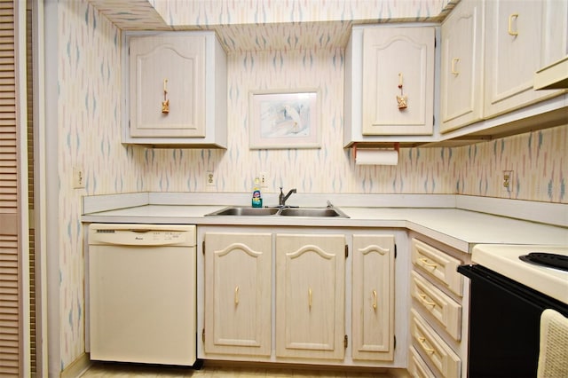 kitchen with white dishwasher, sink, and electric range