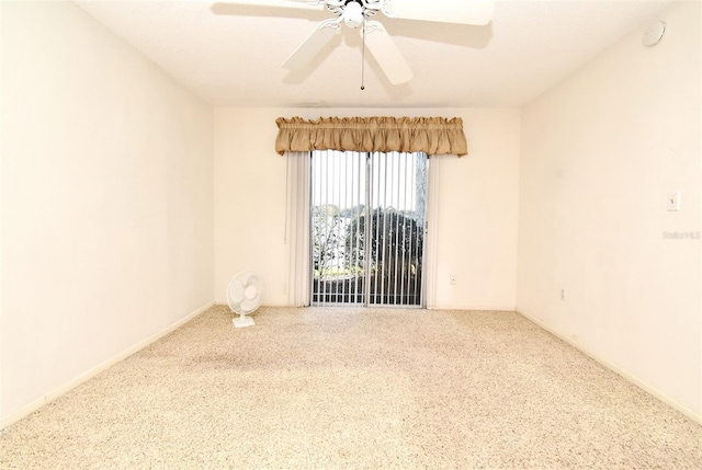 empty room featuring ceiling fan and carpet flooring