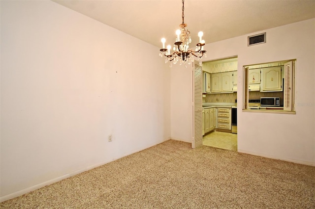 unfurnished dining area with light carpet, a chandelier, visible vents, and baseboards