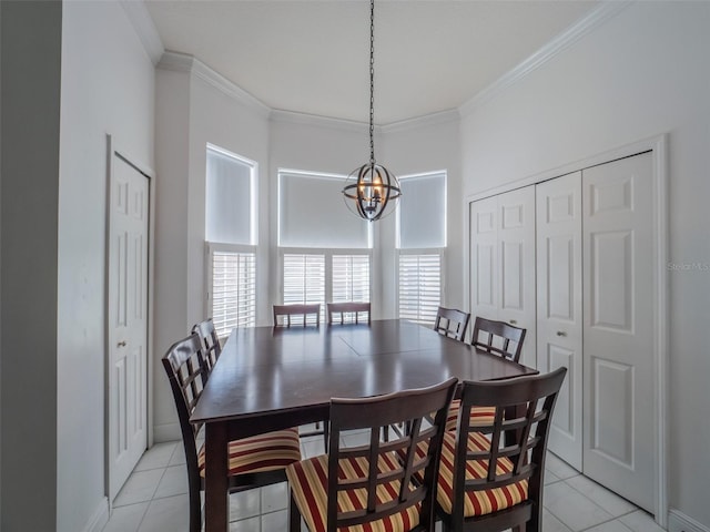 tiled dining space with ornamental molding and an inviting chandelier