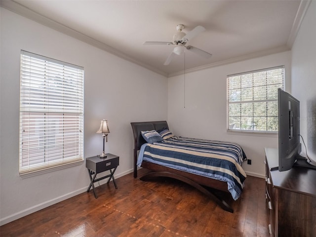 bedroom with crown molding, ceiling fan, and dark hardwood / wood-style flooring