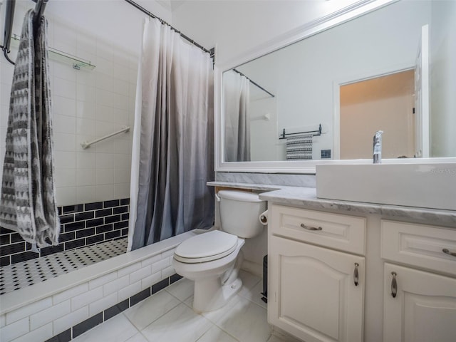 bathroom with vanity, tile patterned flooring, curtained shower, and toilet