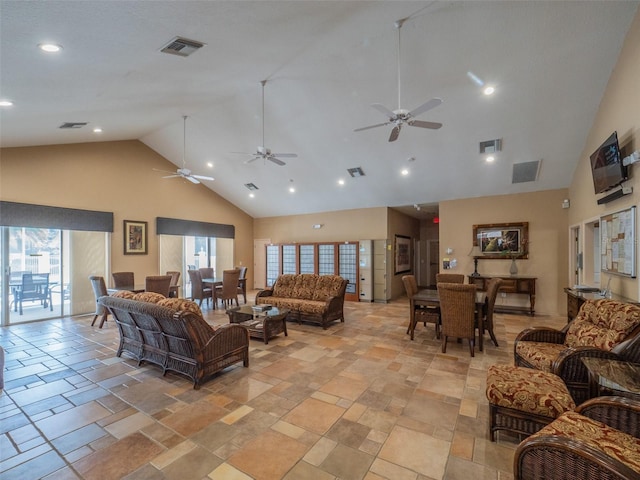 living room featuring high vaulted ceiling