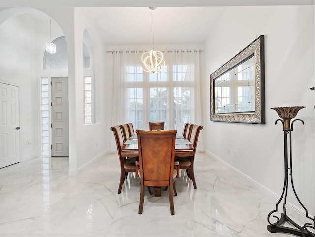 dining space with a chandelier