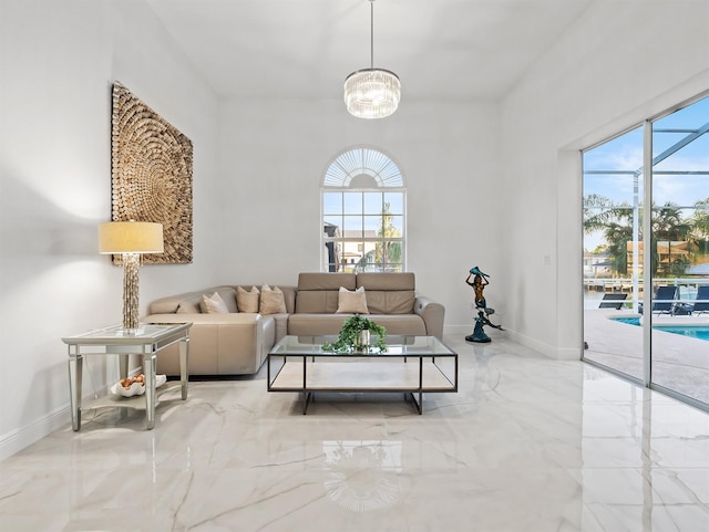 living room featuring an inviting chandelier