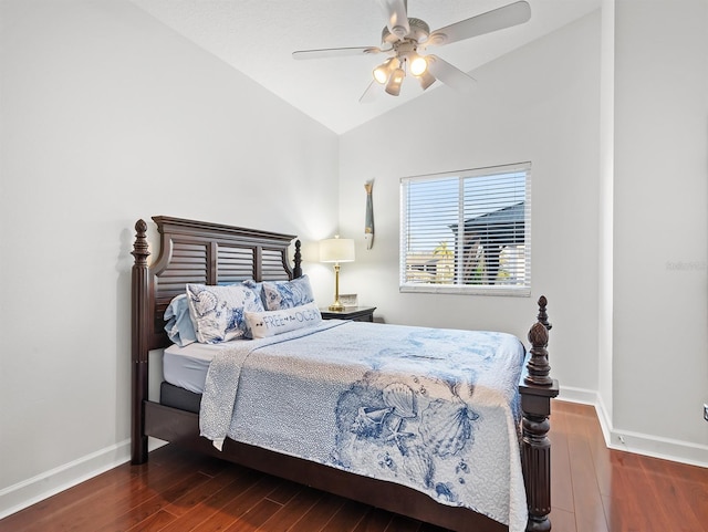 bedroom with ceiling fan, lofted ceiling, and dark hardwood / wood-style flooring