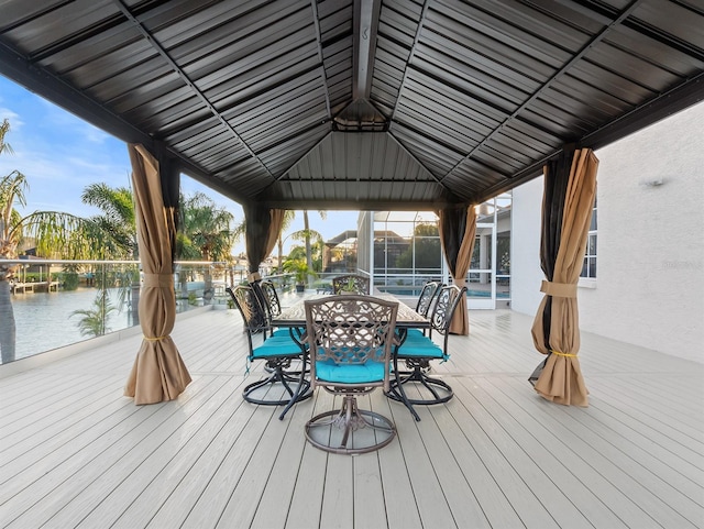 wooden deck featuring a water view