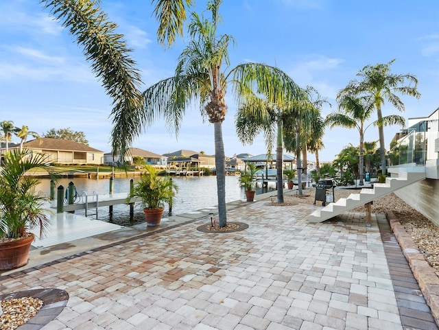 exterior space featuring a water view and a boat dock