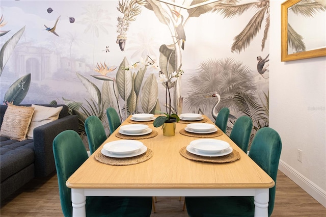 dining space with wood-type flooring