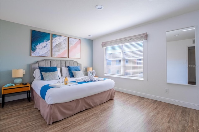 bedroom with wood-type flooring