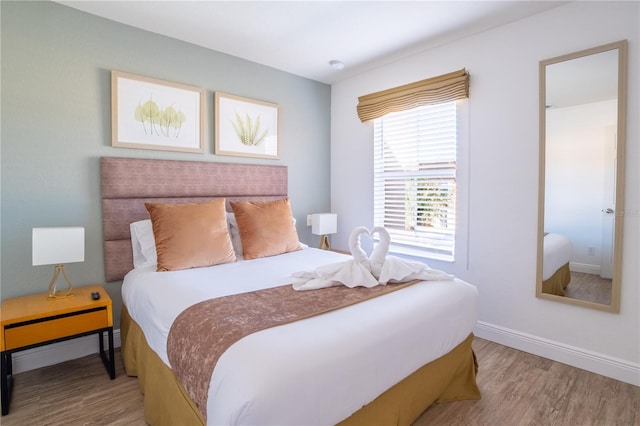 bedroom featuring wood-type flooring