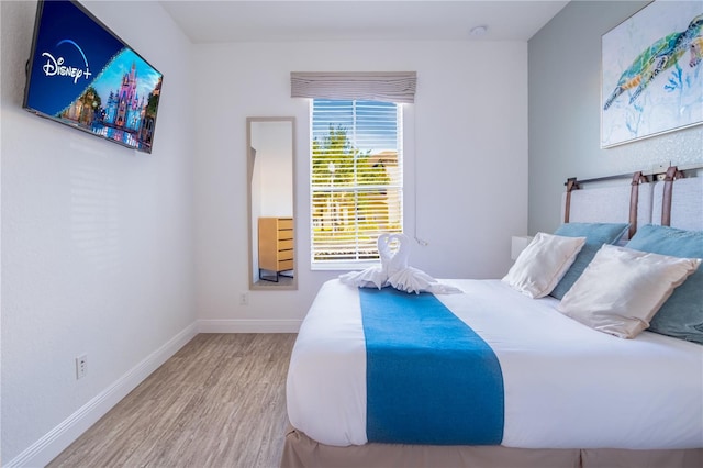 bedroom with wood-type flooring